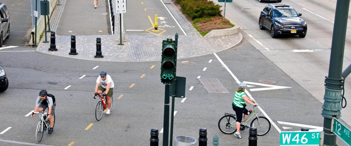 Bicyclists on a busy road