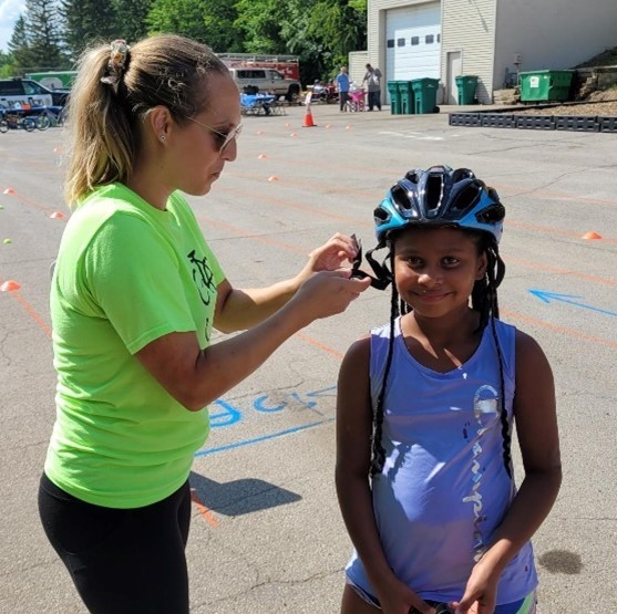 Kid getting bike helmet fitted