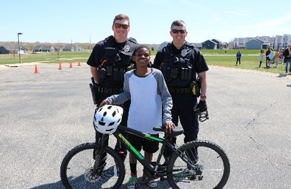 Cops and kid on bike