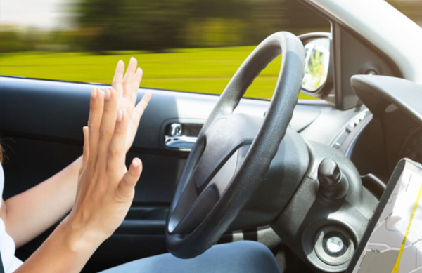 Driver with hands off the wheel