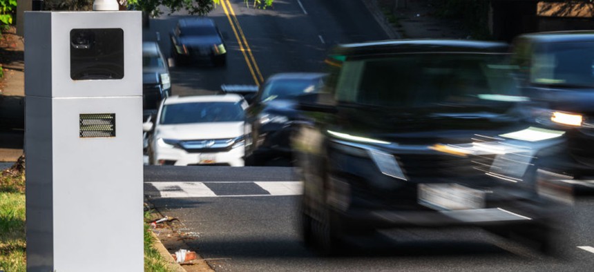 Traffic safety camera with cars speeding by