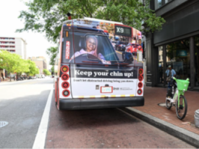 Image of the back of a bus on the street