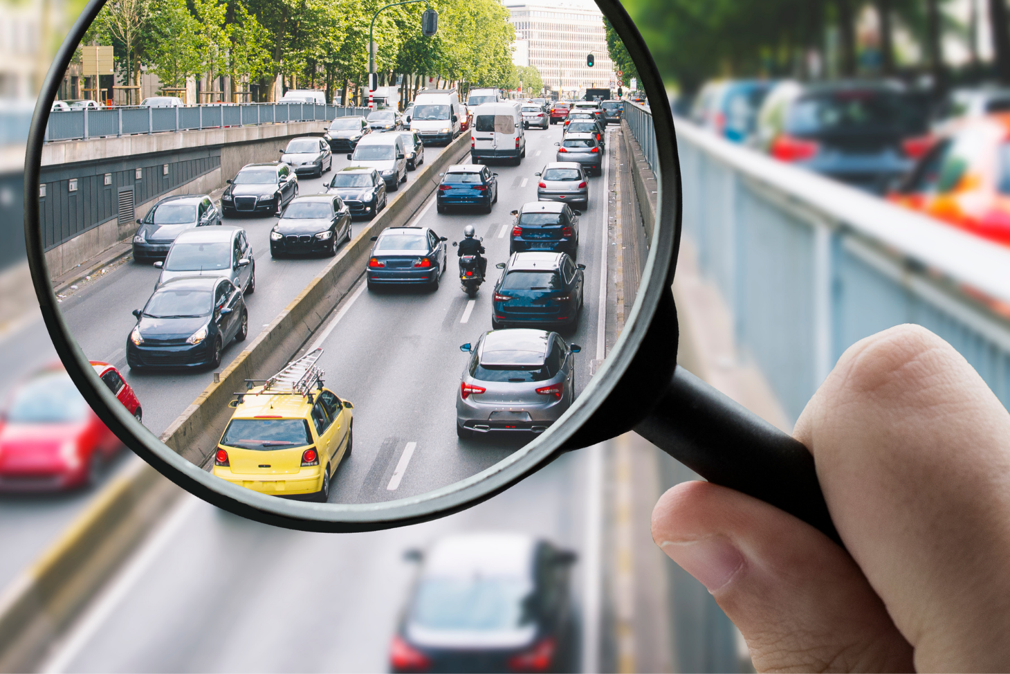 A road with cars viewed through a magnifying glass